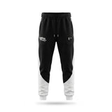 Black and white jogger pants with brand logos on a white background