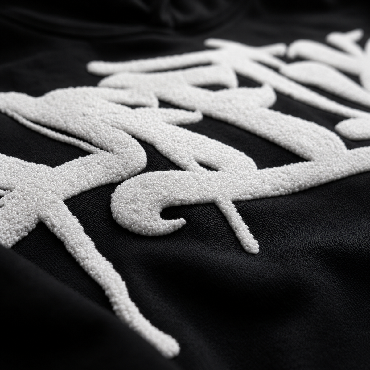 Textured white designs on a black background, image 3