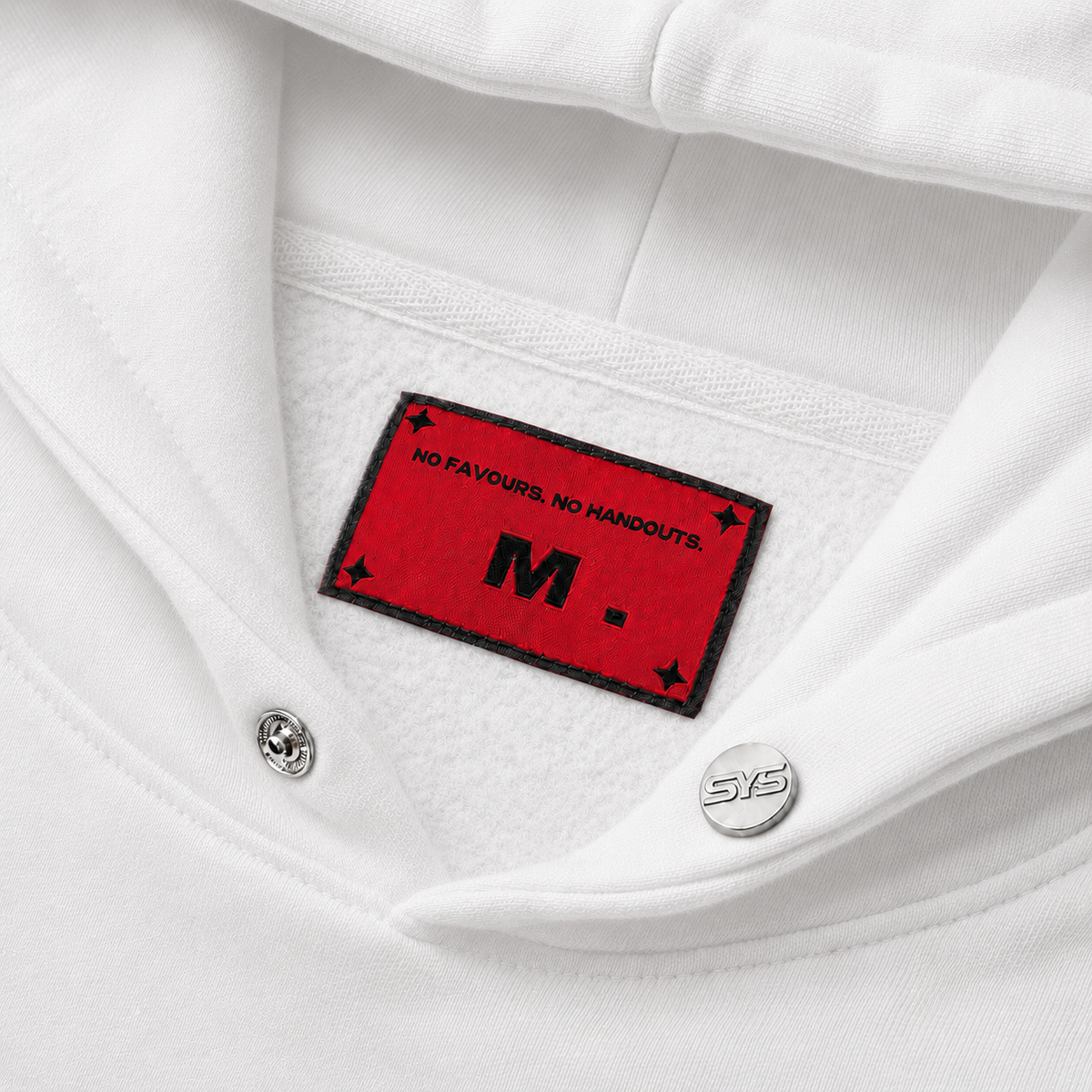 Close-up of a white shirt with a red label featuring text and a logo., image 5