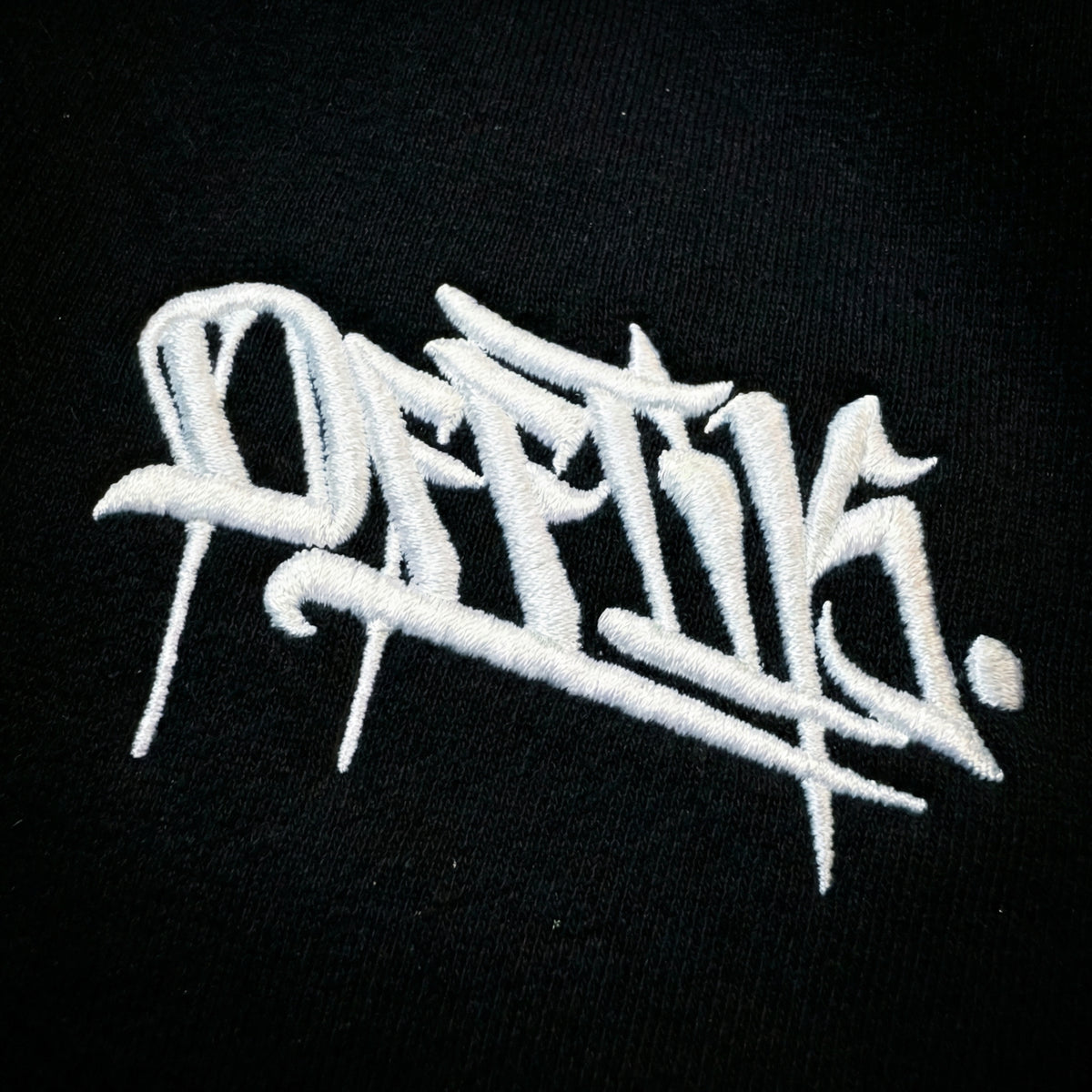 White embroidered text on a black background, image 8
