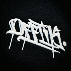 White embroidered text on a black background