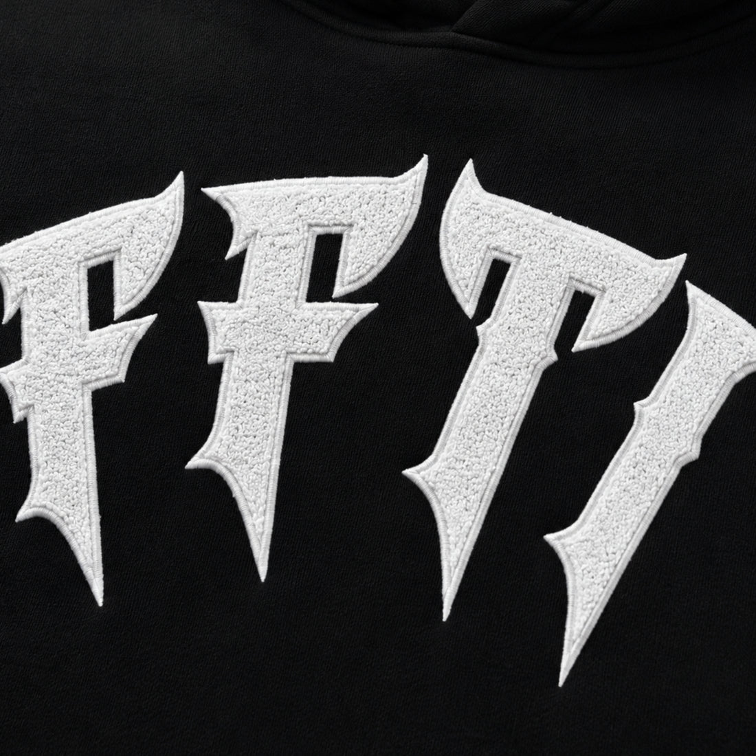 Close-up of a black hoodie with metallic 'FF7' logo., image 7