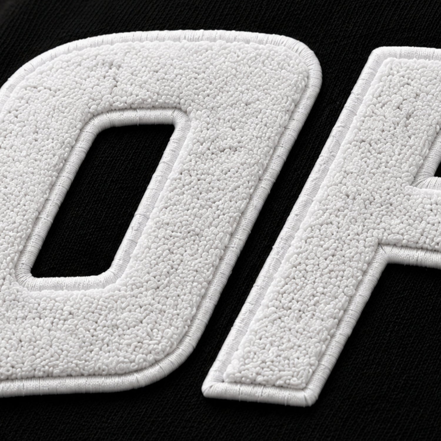 White textured letters on a black background