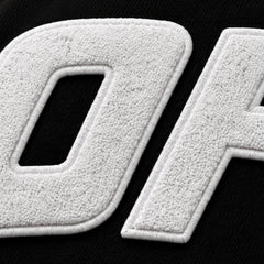 White textured letters on a black background